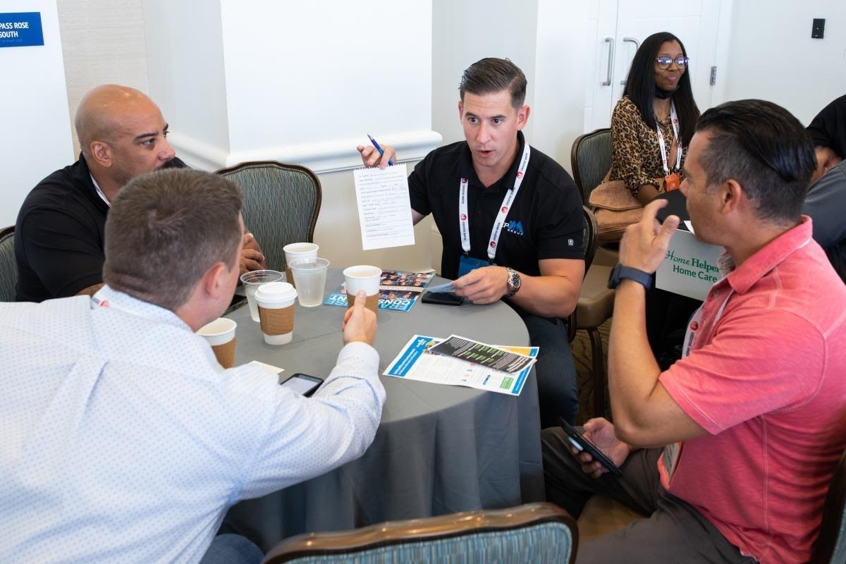 Franchise consultant training in action during collaborative roundtable at IFPG event